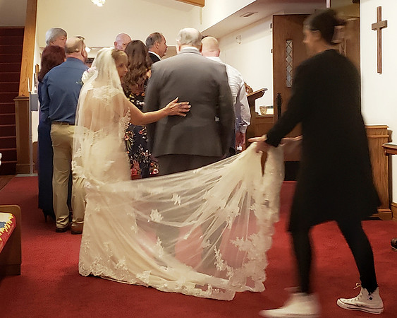 ©230603_1110 Karolyn gives her father a reassuring pat in the UMC northex